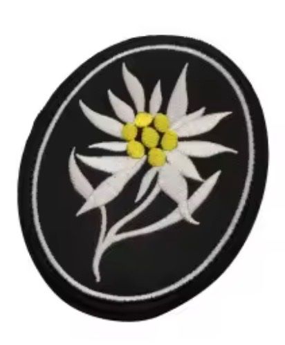 Placchette & Badge: Badge Edelweiss Gebirgsjäger – Nuovo e nell'imballaggio originale da Geuensee venduto da M1812
