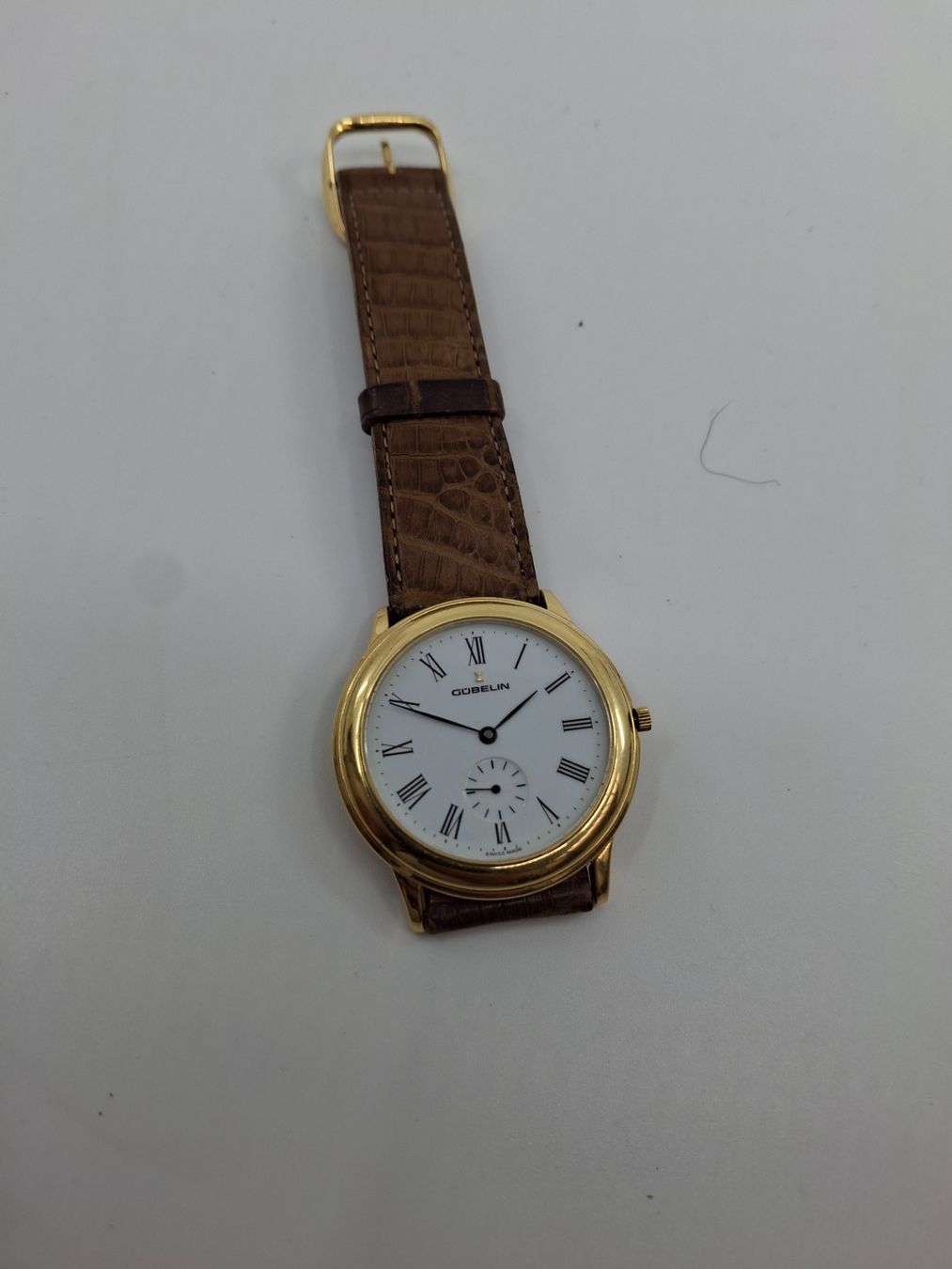 Gübelin Orologi: Gubelin Herrenuhr in 18K Gold – Usato da Basel venduto da Swastikapower 1