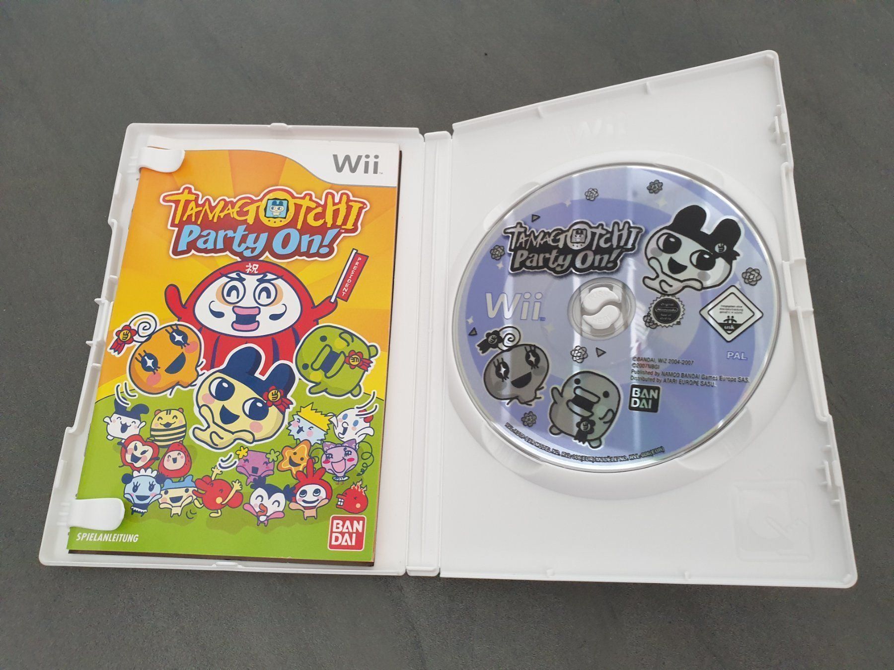 Bandai Spiele: Tamagotchi Party On! Wii – Gebraucht aus Füllinsdorf von  2