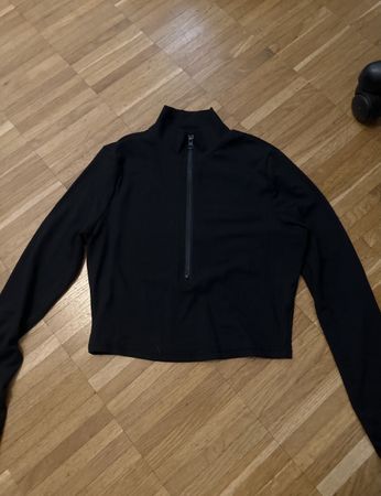 Top noir manches longues avec fermeture éclair taille S