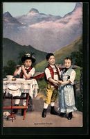 Kinderpaar tanzt in traditioneller Trach