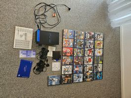 PS2 mit diversen Spielen