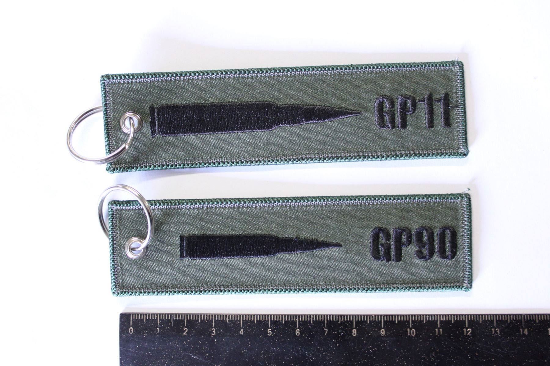 Schlüsselanhänger & - bänder: 2 porte clef tireur GP 11 , GP 90 – Neu (gemäss Beschreibung) aus La plaine von 762 1
