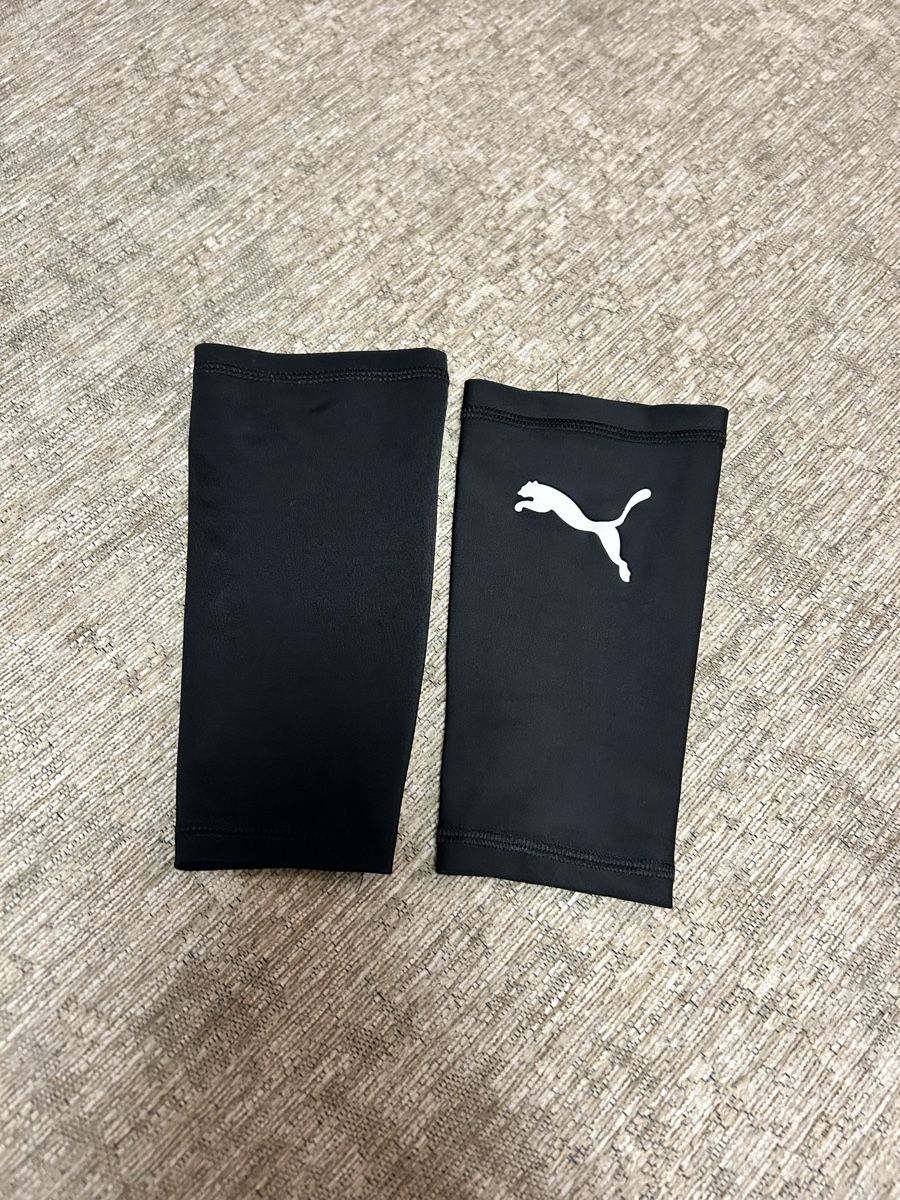 Strümpfe & Strumpfhosen: Manchons de compression Puma noir pour foot – Gebraucht aus St-George von elena27