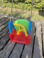 Kinderschaukel Kunststoff bunt mit Schutzbügel gebraucht