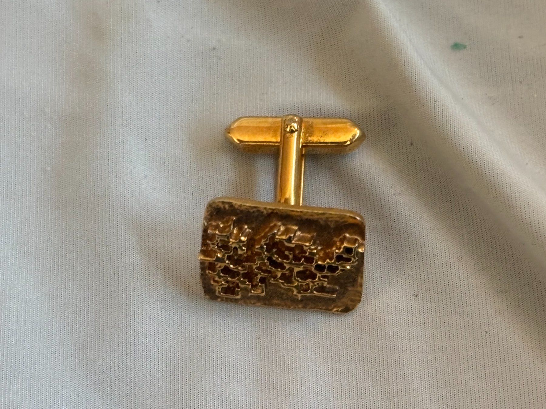Gemelli: Manschettenknopf goldfarben strukturiert – Usato da Birmensdorf ZH venduto da SwissQualityTrade