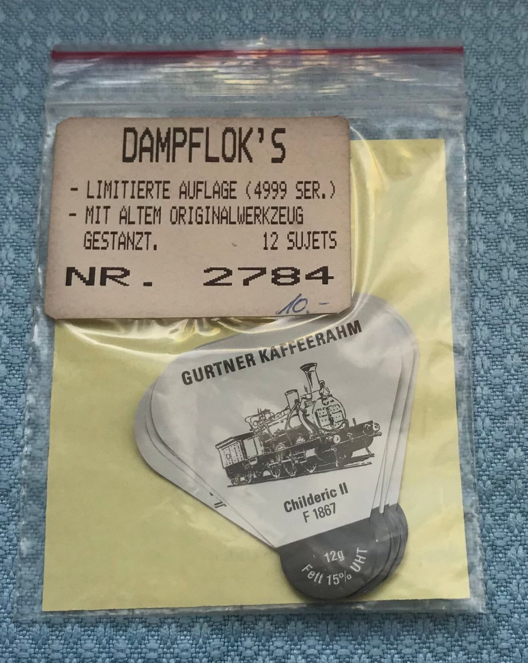 Kaffeerahmdeckel: 12 Gurtner Kaffeerahm Deckel Dampfloks – Neu und originalverpackt aus Uznach von Chrisanteme 1