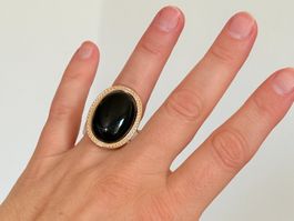 Bague or pierre noire forme ovale resize
