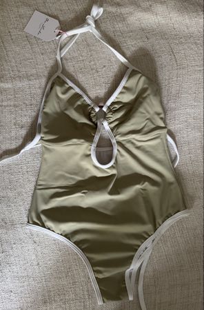 One-piece swimsuit with ring detail. Perfect for summer!