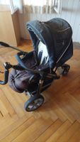 Gebrauchter Kinderwagen in dunkelblau mit braunem Einsatz