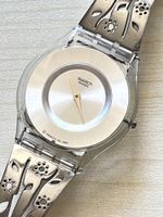 Swatch Skin Damenuhr Metallarmband floral transparent