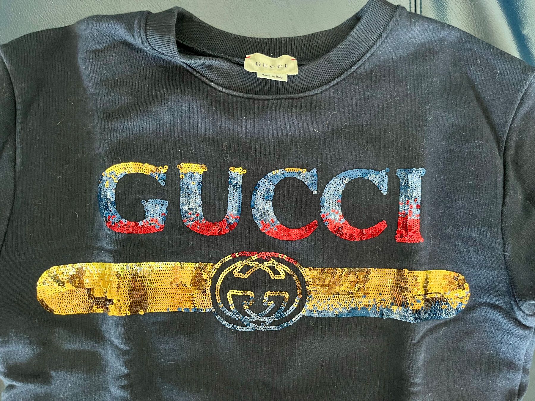 Gucci Pulls & Sweat-shirts: Pull Gucci noir logo paillettes taille enfant – D'occasion à St-Blaise par Yeeppp 1