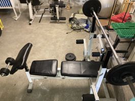 Weight bench with barbell and weights white condition