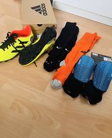Protège tibia et baskets pour le football