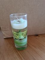 Dekorative Kerze mit Schmetterling im Glas 