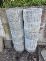12 Pflanzsteine aus Beton.