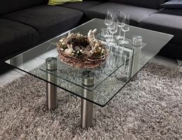 Moderner Glastisch / Couchtisch mit Edelstahlfüssen