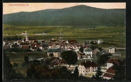 Courrendlin, Teilansicht mit Strassenpar