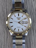 Seiko 5 D/D Auto white face gold markers.September 2010.