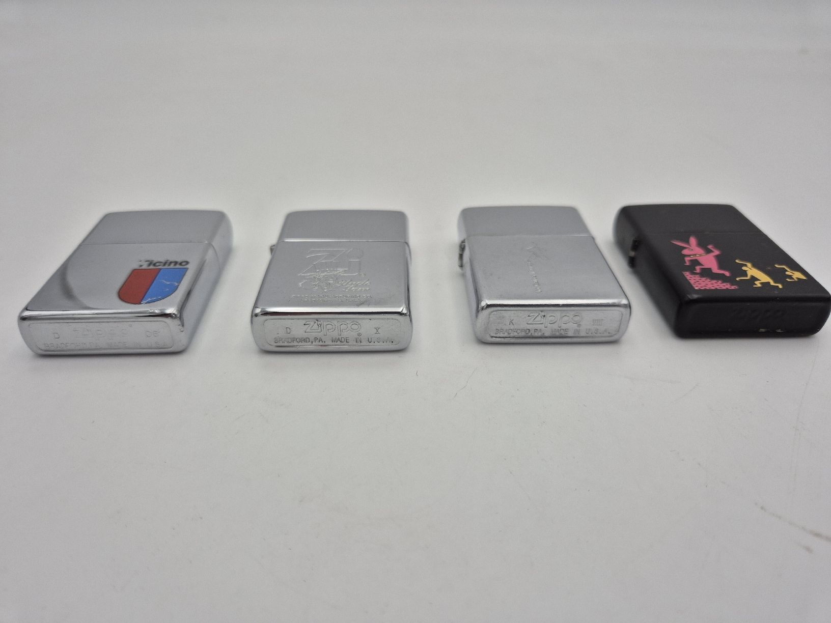 Zippo Feuerzeuge: 4 Briquets Zippo – Gebraucht aus Chambrelien von  1