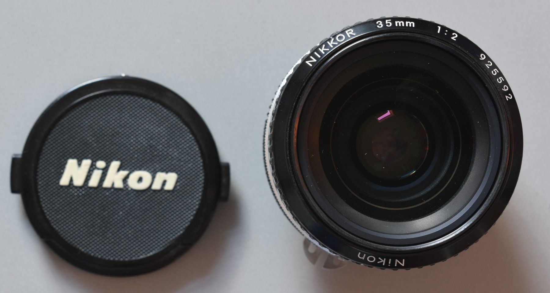 Nikkor Obiettivi: Nikon Nikkor 35mm 1:2 inkl. HN-3 Sonnenblende – Usato da Basel venduto da magicpower99 2