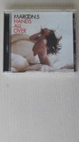 Musik-CD der Pop-Rock-Band "Maroon 5"