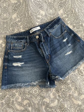 Short en jean bleu taille36 déchiré franges usé
