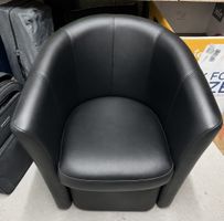 Fauteuil noir design cuir très bon état repose pied intégré 