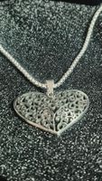 Collana con ciondolo a cuore traforato in acciaio inox