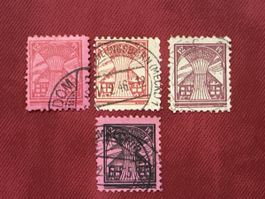 Quatre timbres allemands 12 Pfennig oblitérés