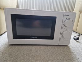 White Durabse Microwave - Great for quick summer meals.