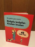 Bilderbuch-Knöpfe knöpfen, Knoten knoten