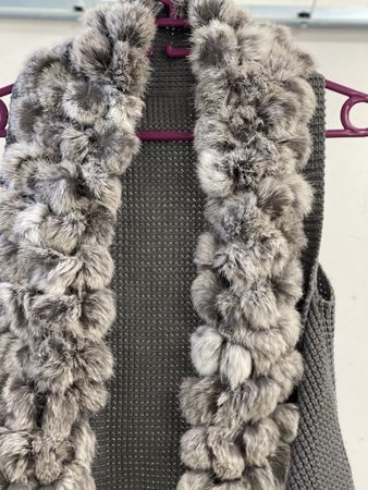 Chic grey knitted vest with faux fur trim, perfect for autum