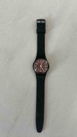 Montre Swatch noir cadran marron etat acceptable