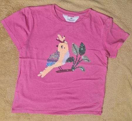 Farbenfrohes H&M Mädchen T-Shirt mit Pailletten-Papagei