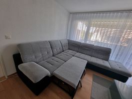 Grosse, gemütliche Ecksofa in grau zu verkaufen