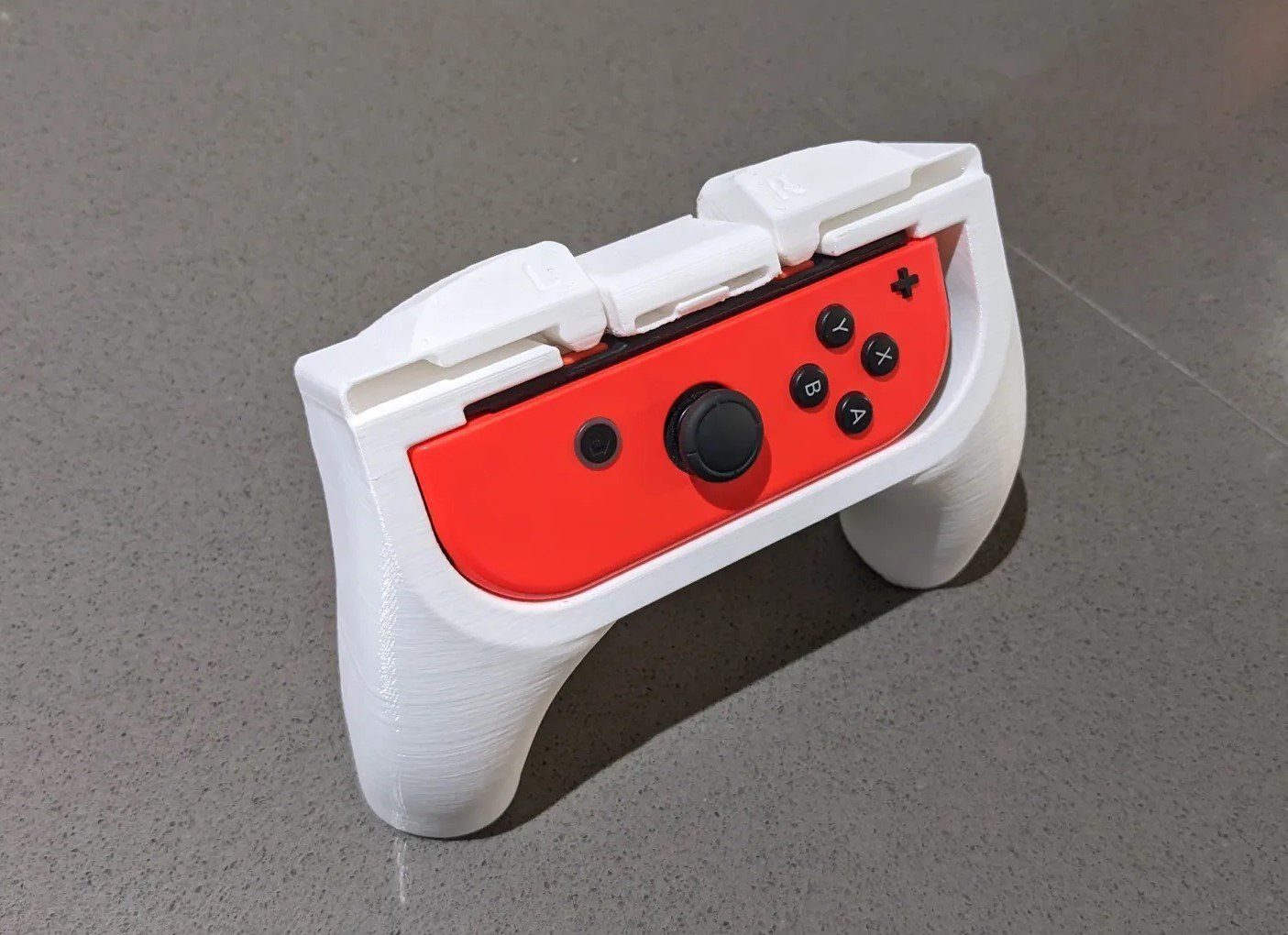 Nintendo Giochi: Ergonomische Joycon Griff Nintendo Switch – Nuovo e nell'imballaggio originale da Dietikon venduto da You_Want_We_Print 1