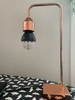 Rose gold bedside lamp.