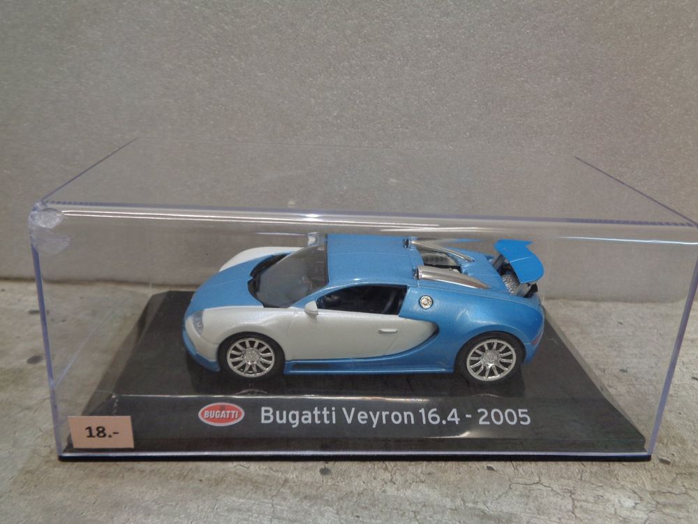 manufacturer: Altaya scale: 1:43 Vehicle: Bugatti Veyron 16.4 Year: 2005 Article ID: magSCBugatti colour: mat white / light blue The model was produced in the usual Altaya high-quality and reflects