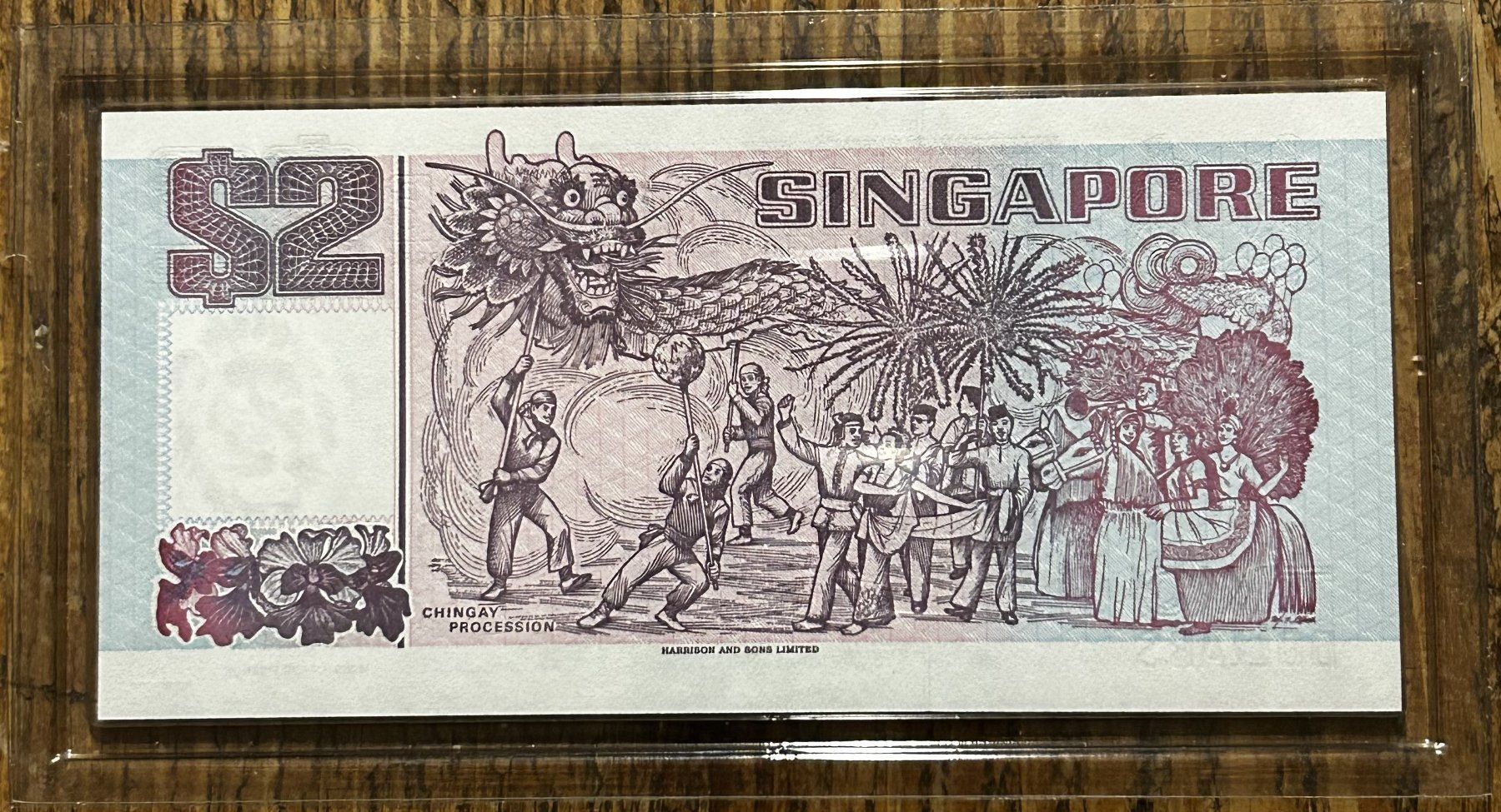 Banconote: 2 Dollars violet UNC Singapore 1997 – Nuovo e nell'imballaggio originale da Tavannes venduto da Zitume 1