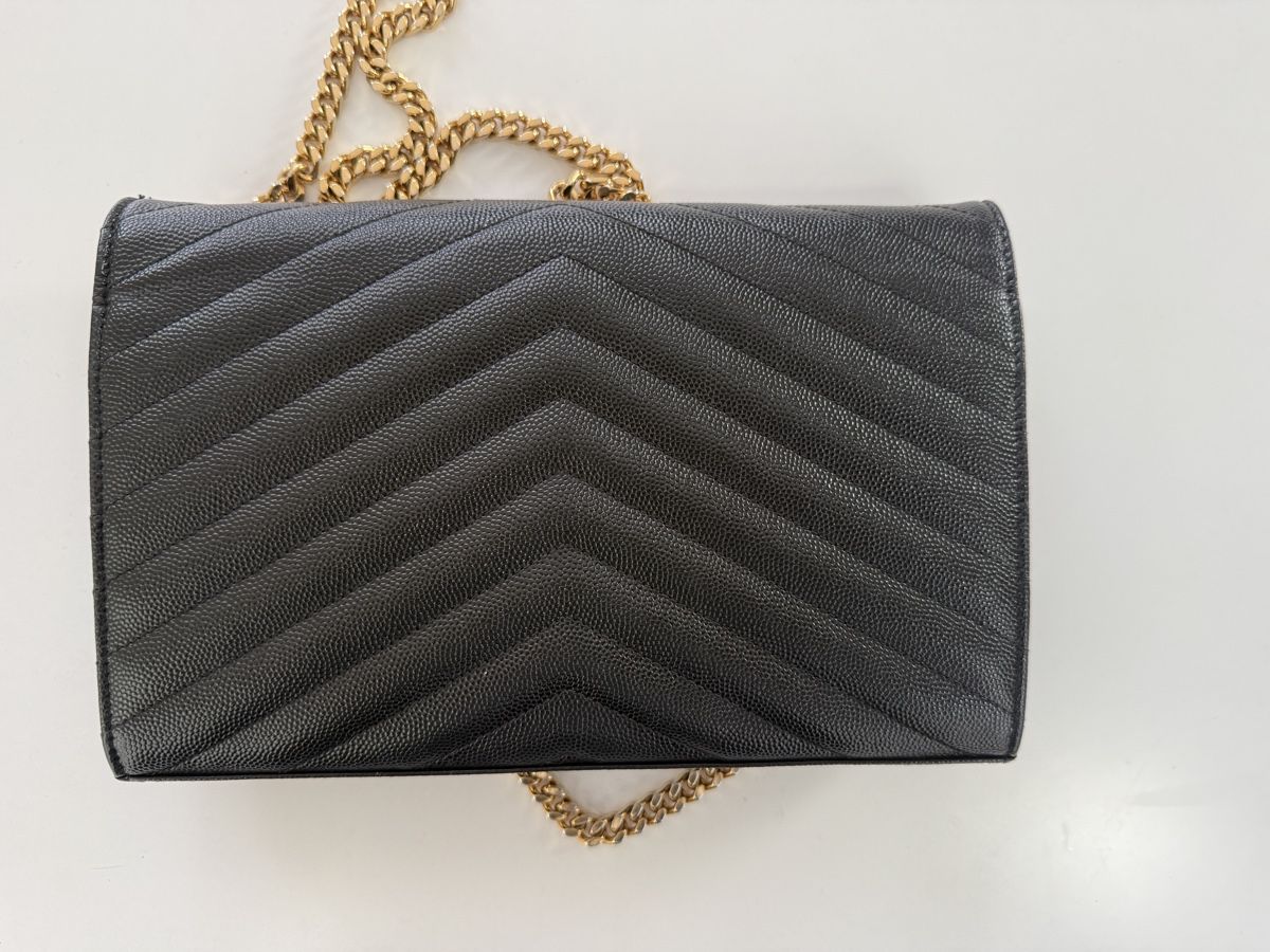 Saint Laurent Sacs femmes: Saint Laurent Tasche Schwarz mit Gold – D'occasion à Zürich par vintagewiedikon 3
