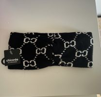 Fascia per capelli Chicoree Accessoires, nera e bianca.