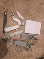 Nintendo Wii blanche + 2 manettes + 2 Nunchuk + accessoires