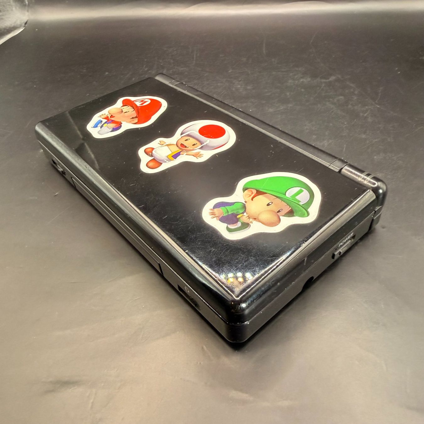 Nintendo Console: Nintendo DS Lite Schwarz – Difettoso da Düdingen venduto da Nerdworld 3