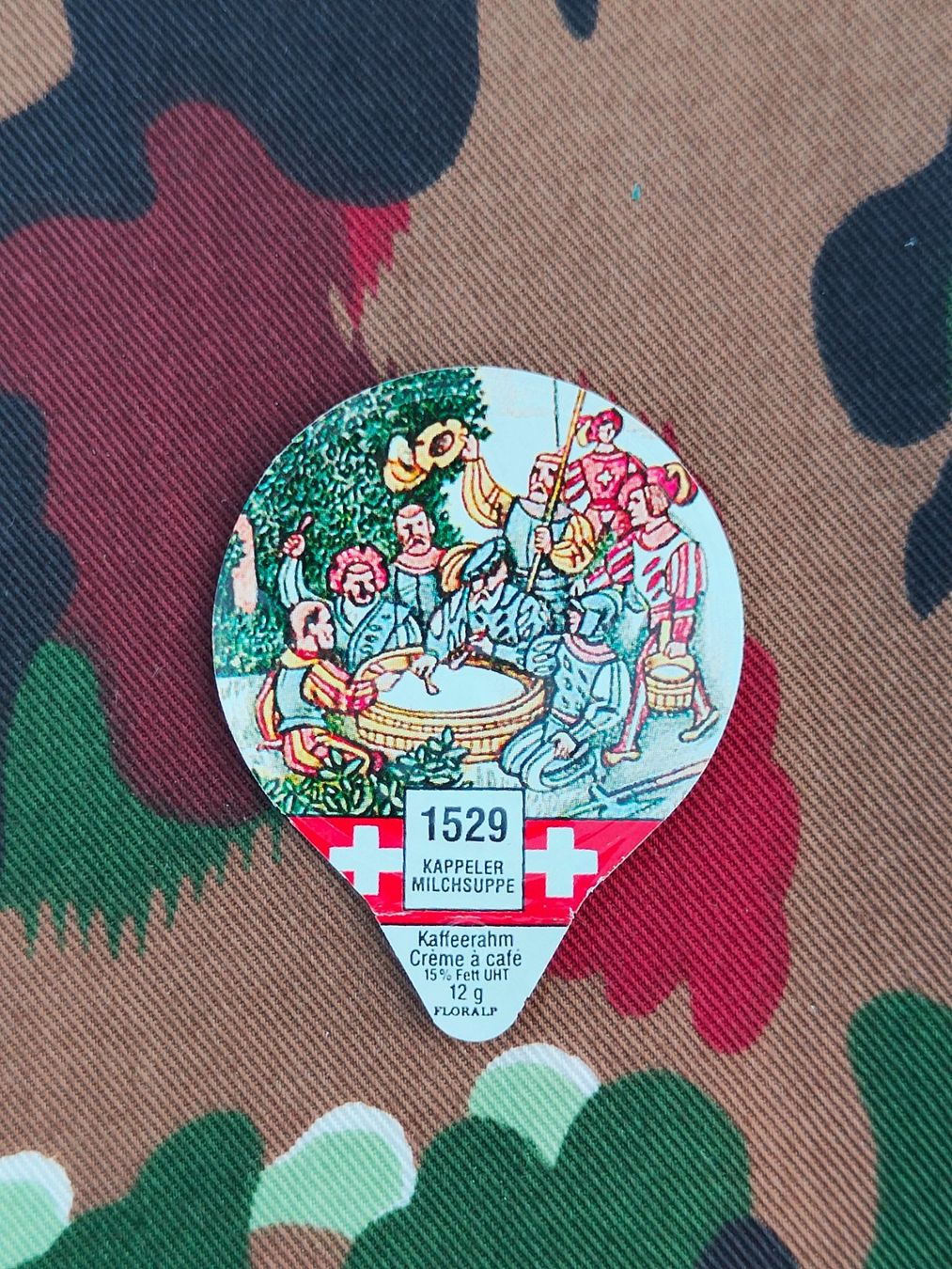 Coperchi dei cremini per caffè: Kaffeerahmdeckel 1529 KAPPELER MILCHSUPPE – Usato da Bauma venduto da SwissMilitaria