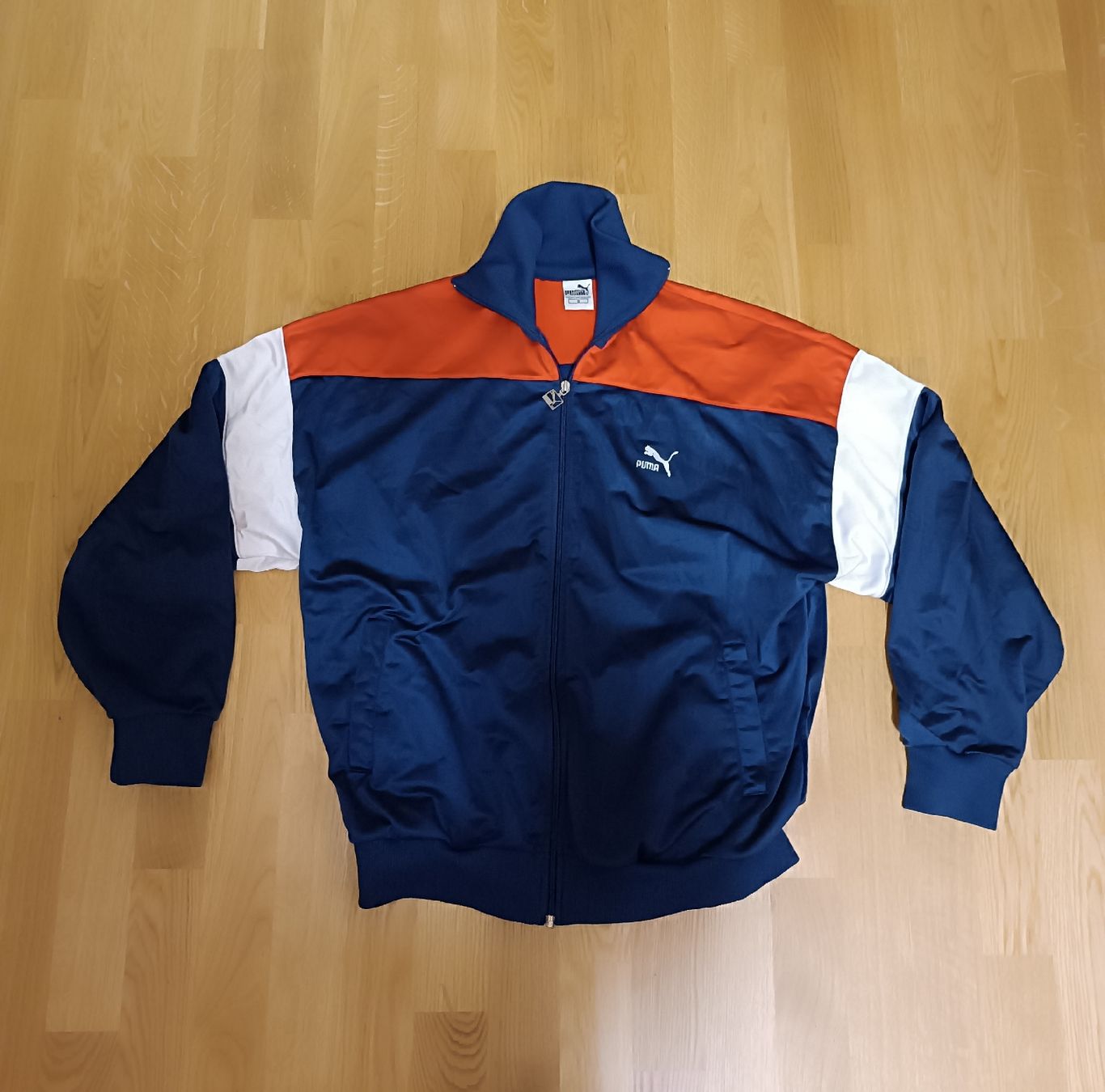 Puma Giacche: Puma Trainingsjacke Blau Orange Weiss Grösse L – Usato da Basel venduto da tracka