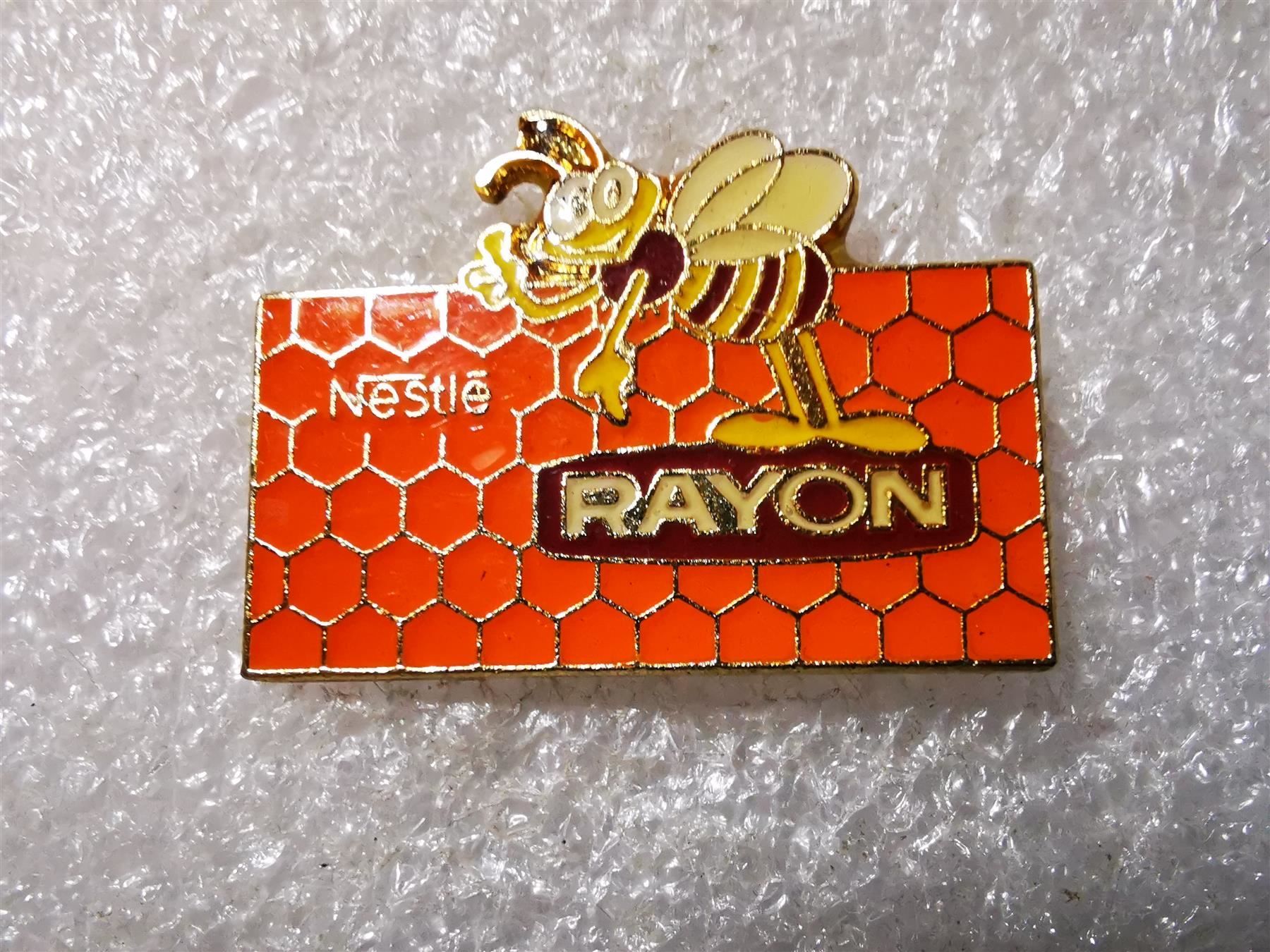 Placchette & Badge: Ansteckpin 10: Nestle Rayon – Usato da Oppligen venduto da Pin-Fall-Shop