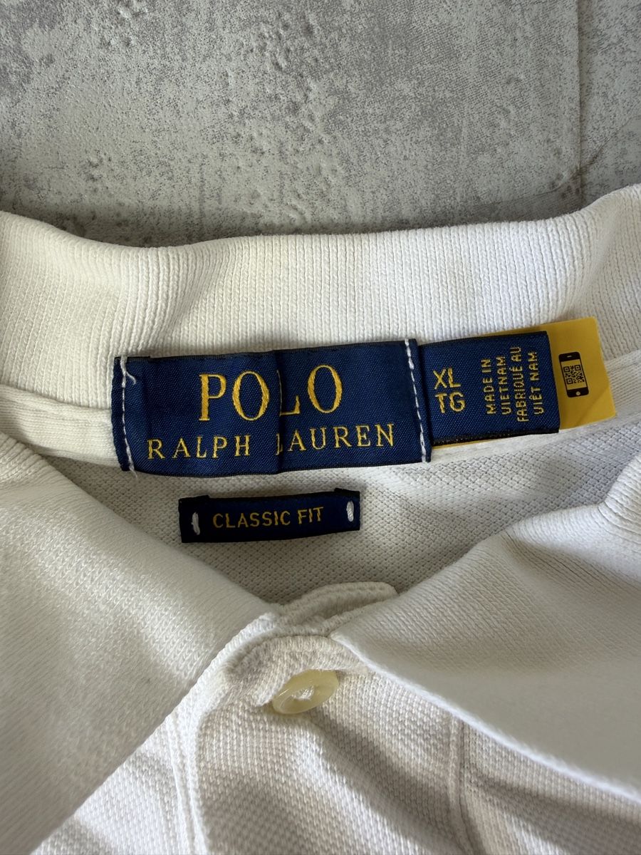 Ralph Lauren Polos: Polo Ralph Lauren blanc Multi logo bleu - XL QR code #25 – Neuf (Voir description) à Hauterive NE par Leo_o 1