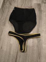 Set intimo nero con paillettes e borchie dorate