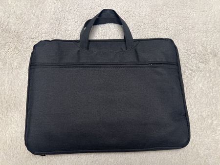 Sacoche ordinateur portable noire, spacieuse et pratique